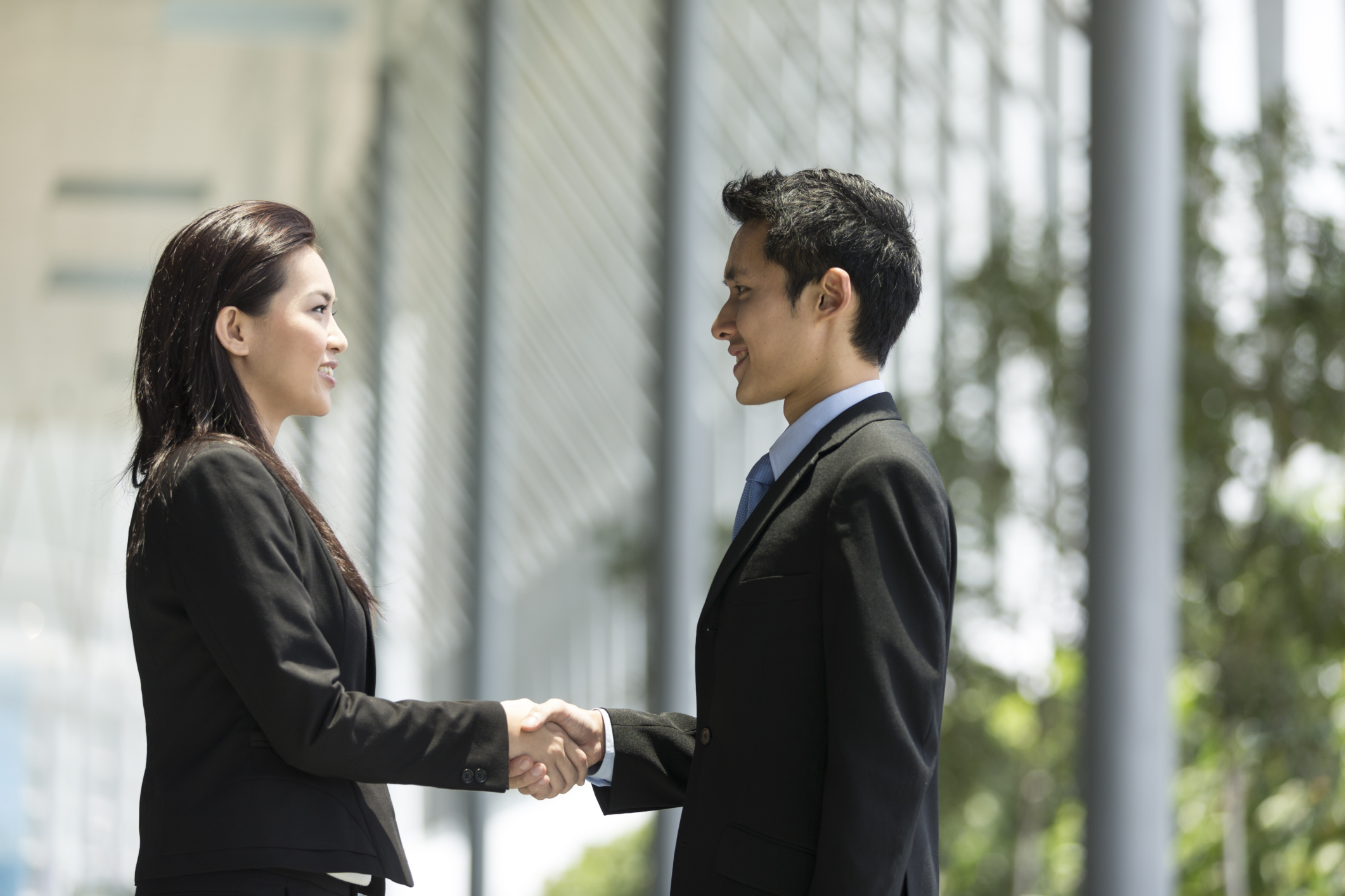 asian business man and woman shake hands connect#